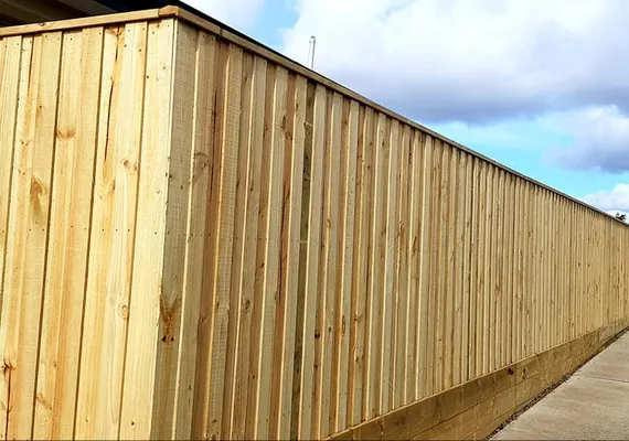 Paling fence with capping installed across a Geelong boundary